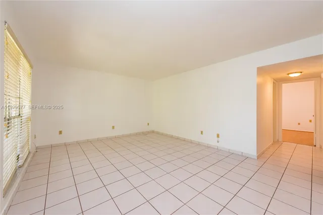 a view of an empty room and window