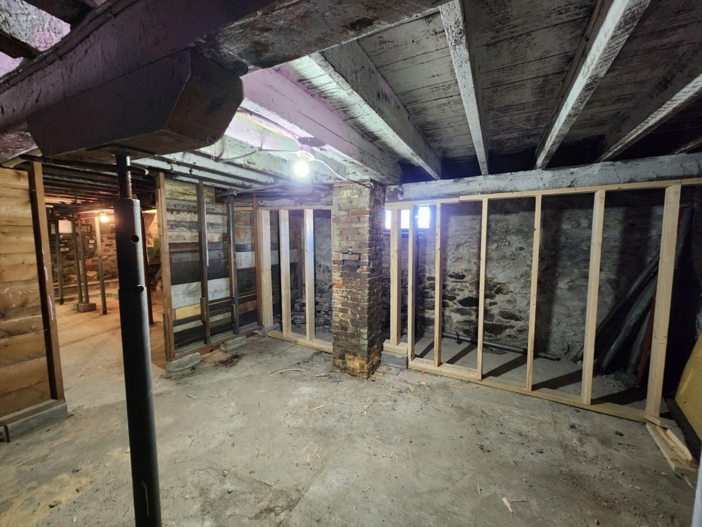 6 McIntyre Street Lowell, MA 01851 - Photo 11 of 12 a view of an empty room with wooden walls