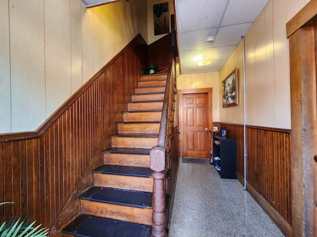 6 McIntyre Street Lowell, MA 01851 - Photo 2 of 12 a view of entryway with wooden floor