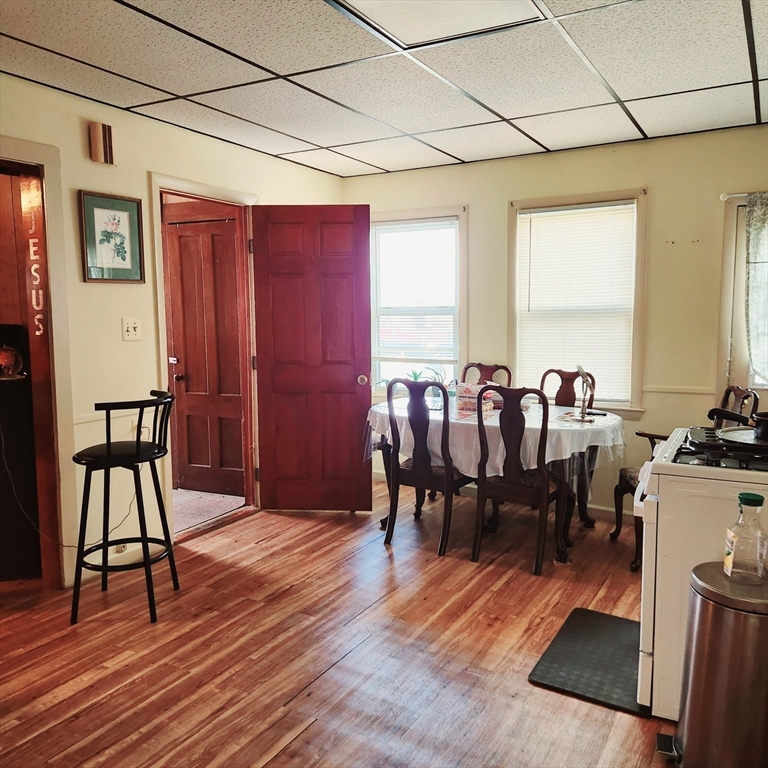 6 McIntyre Street Lowell, MA 01851 - Photo 3 of 12 a view of a dining room with furniture and chandelier