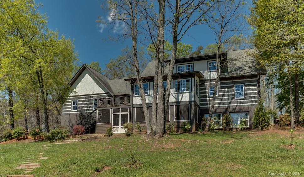 1180 Golf Course Road Tryon, NC 28782 - Photo 2 of 24 front view of a house with a yard