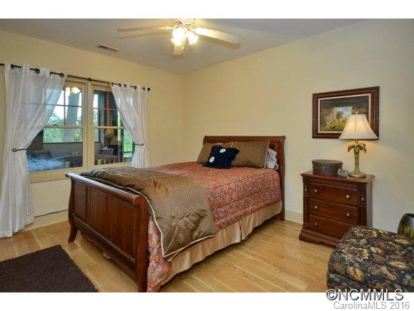 1180 Golf Course Road Tryon, NC 28782 - Photo 12 of 24 a bedroom with a bed and window