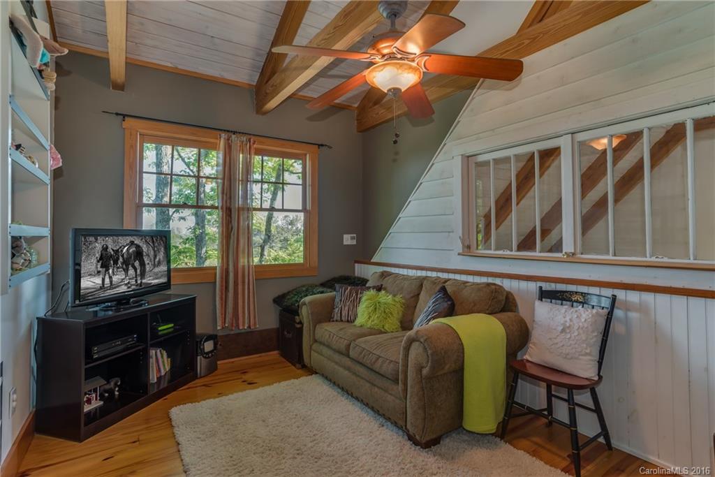 1180 Golf Course Road Tryon, NC 28782 - Photo 13 of 24 a living room with furniture and a window