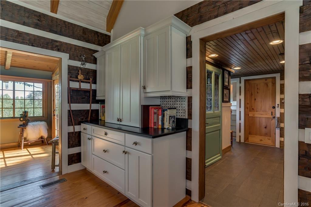 1180 Golf Course Road Tryon, NC 28782 - Photo 15 of 24 a kitchen with stainless steel appliances kitchen island granite countertop a refrigerator and a stove top oven