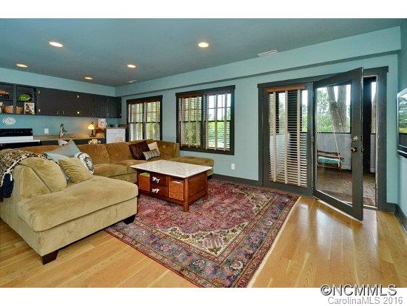 1180 Golf Course Road Tryon, NC 28782 - Photo 17 of 24 a living room with furniture and a rug