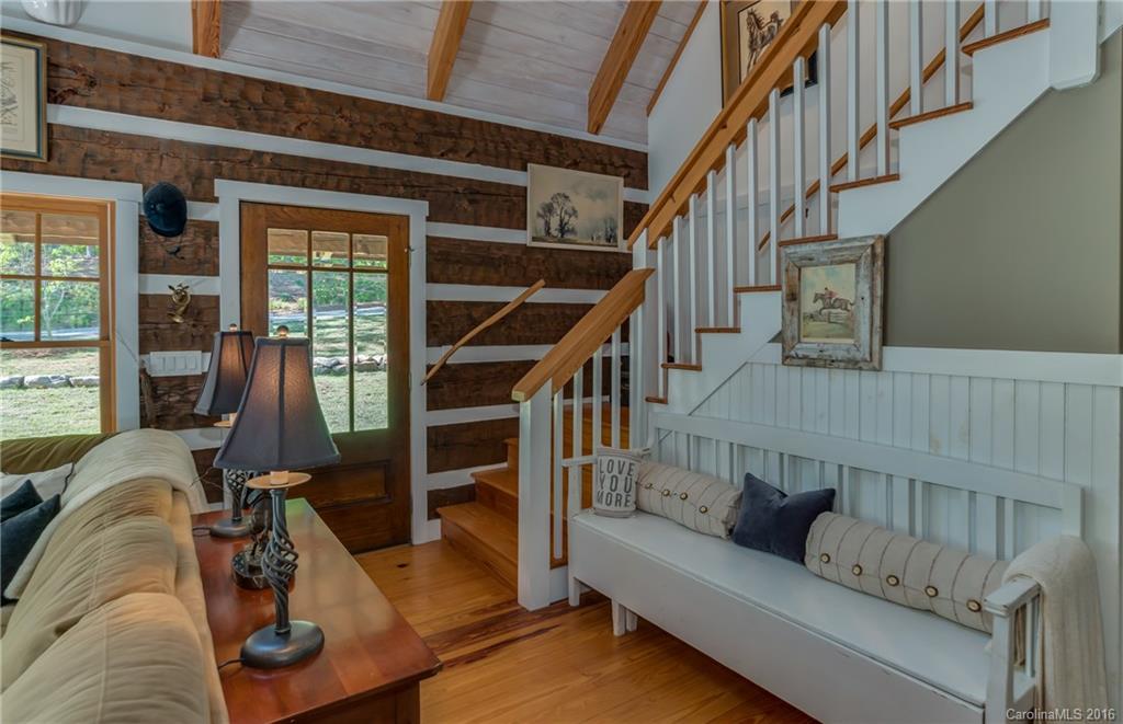 1180 Golf Course Road Tryon, NC 28782 - Photo 3 of 24 a view of livingroom with furniture and stairs