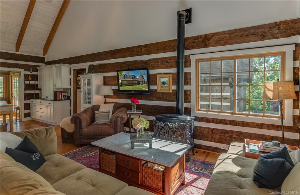 1180 Golf Course Road Tryon, NC 28782 - Photo 5 of 24 a living room with furniture and a flat screen tv