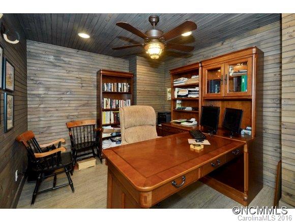 1180 Golf Course Road Tryon, NC 28782 - Photo 10 of 24 a living room with furniture a chandelier and a dining table