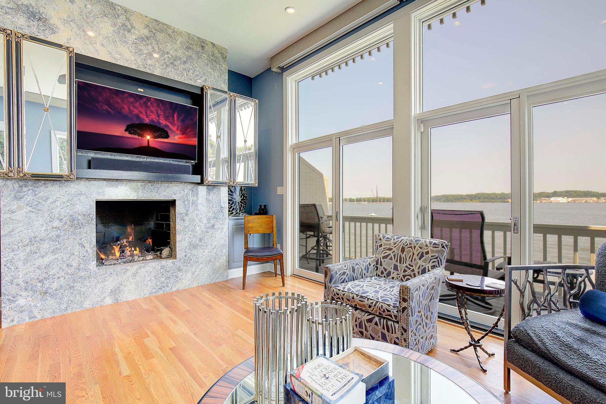 8 Eastern Avenue Annapolis, MD 21403 - Photo 15 of 55 a living room with furniture a flat screen tv and a fireplace