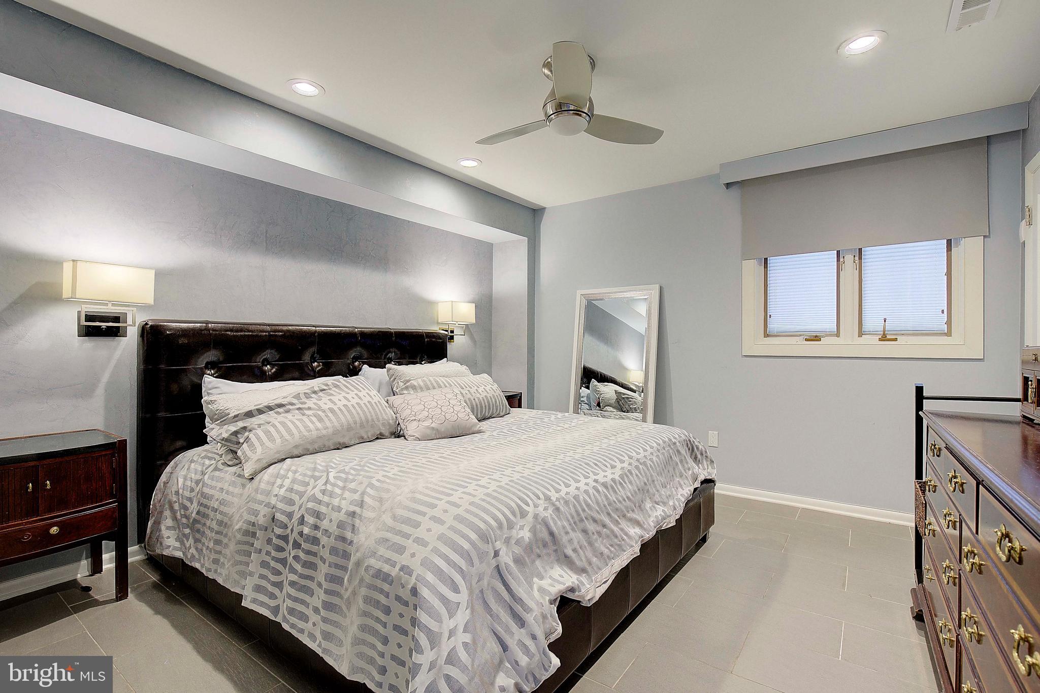 8 Eastern Avenue Annapolis, MD 21403 - Photo 19 of 55 a bedroom with bed and wooden floor