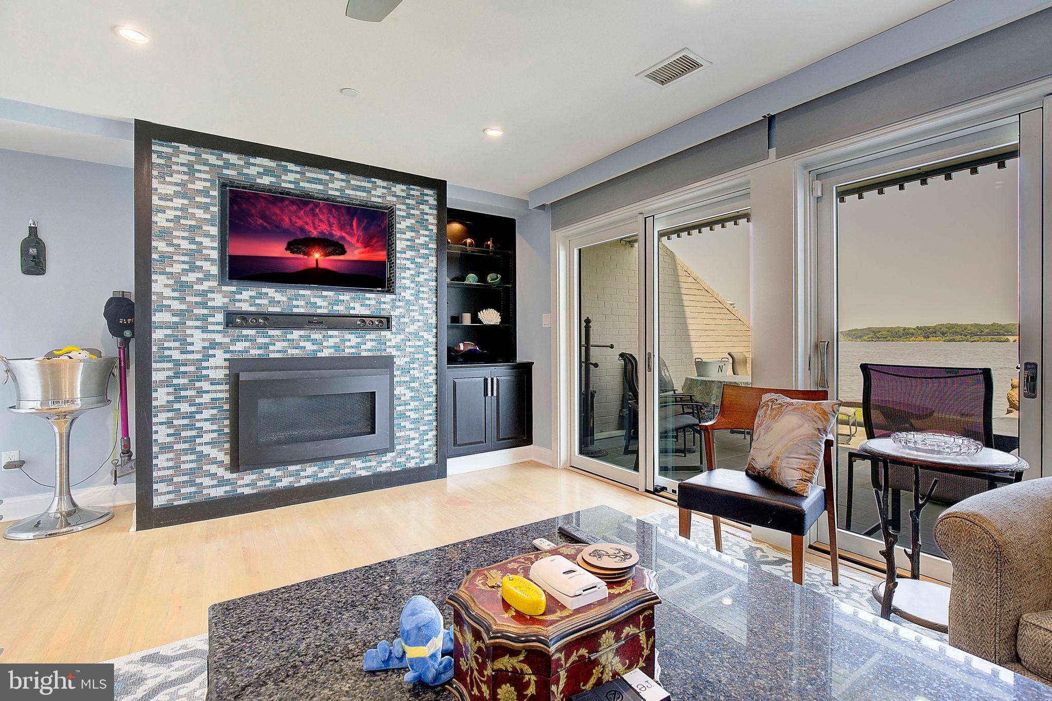 8 Eastern Avenue Annapolis, MD 21403 - Photo 23 of 55 a living room with furniture a flat screen tv and a fireplace