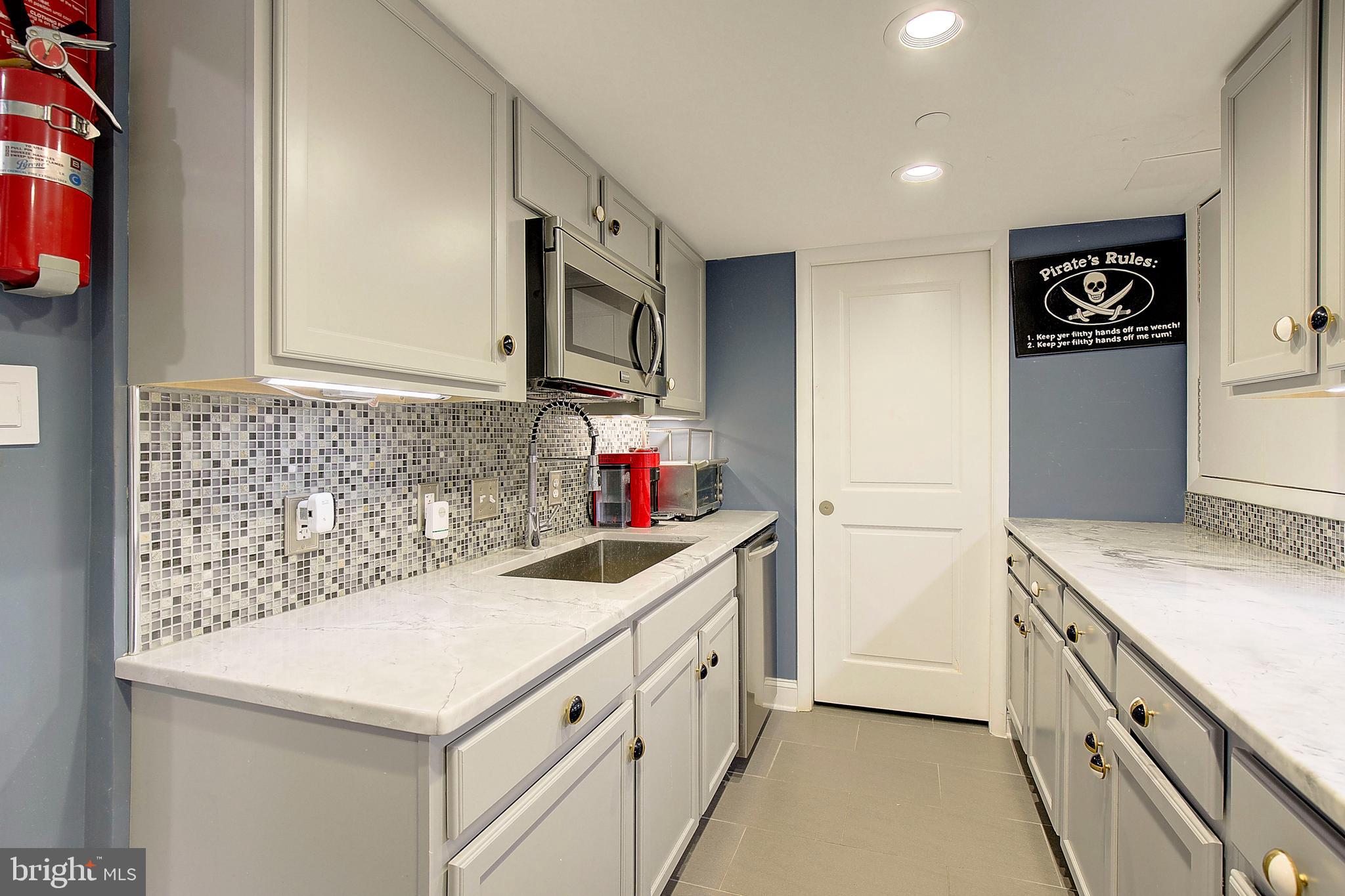 8 Eastern Avenue Annapolis, MD 21403 - Photo 25 of 55 a utility room with cabinets washer and dryer
