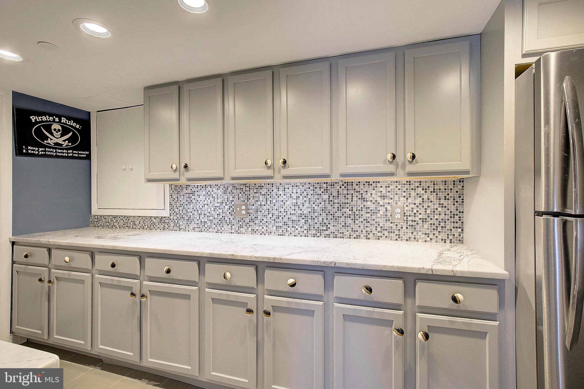 8 Eastern Avenue Annapolis, MD 21403 - Photo 26 of 55 a kitchen with granite countertop white cabinets and stainless steel appliances