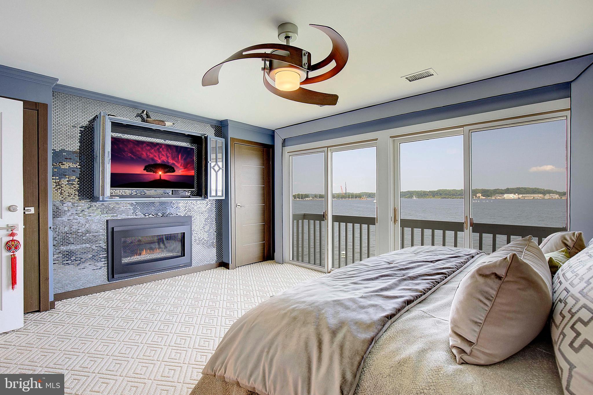 8 Eastern Avenue Annapolis, MD 21403 - Photo 28 of 55 a bedroom with a bed and a fireplace