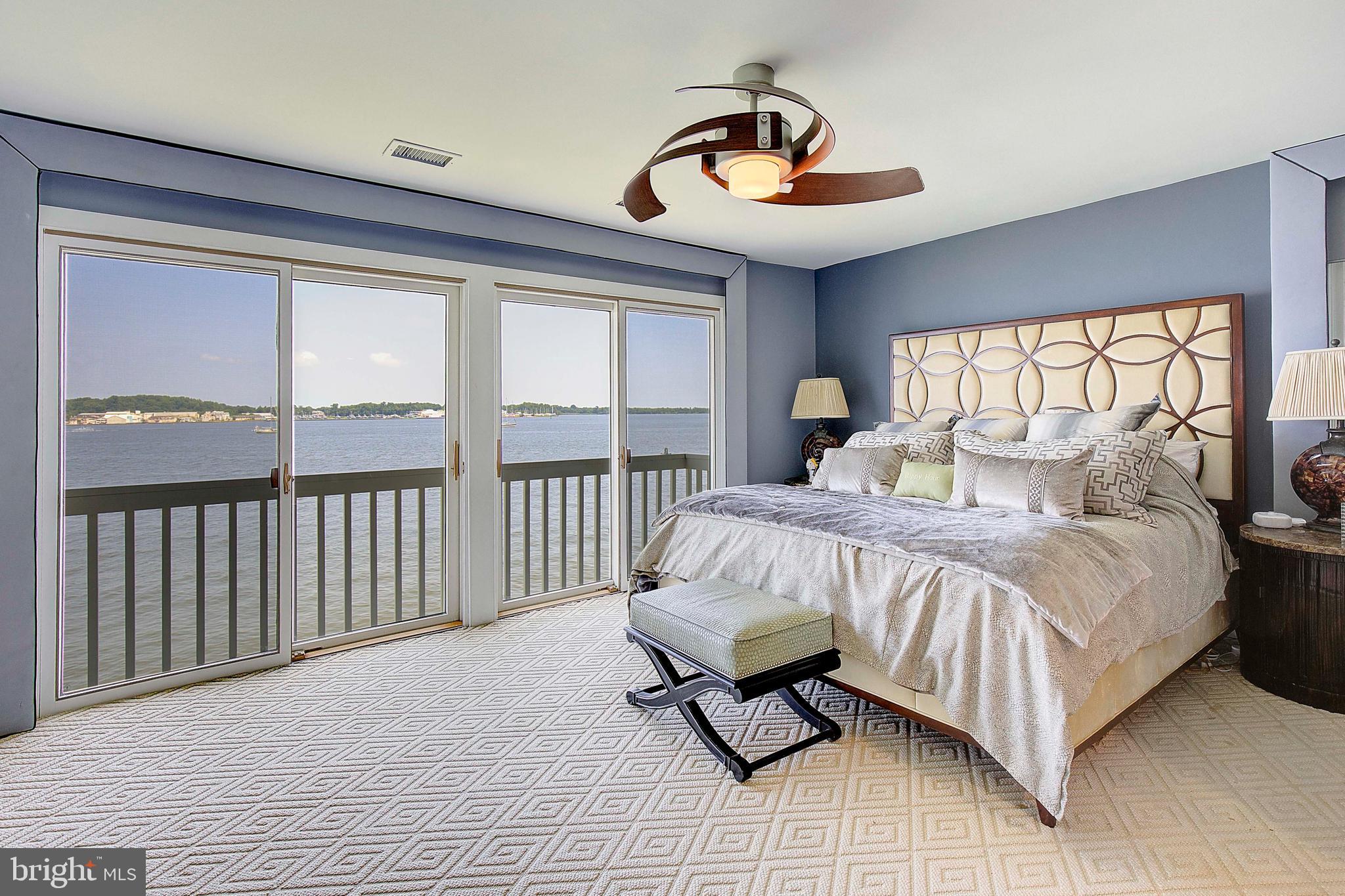 8 Eastern Avenue Annapolis, MD 21403 - Photo 29 of 55 a bedroom with a bed and a chandelier