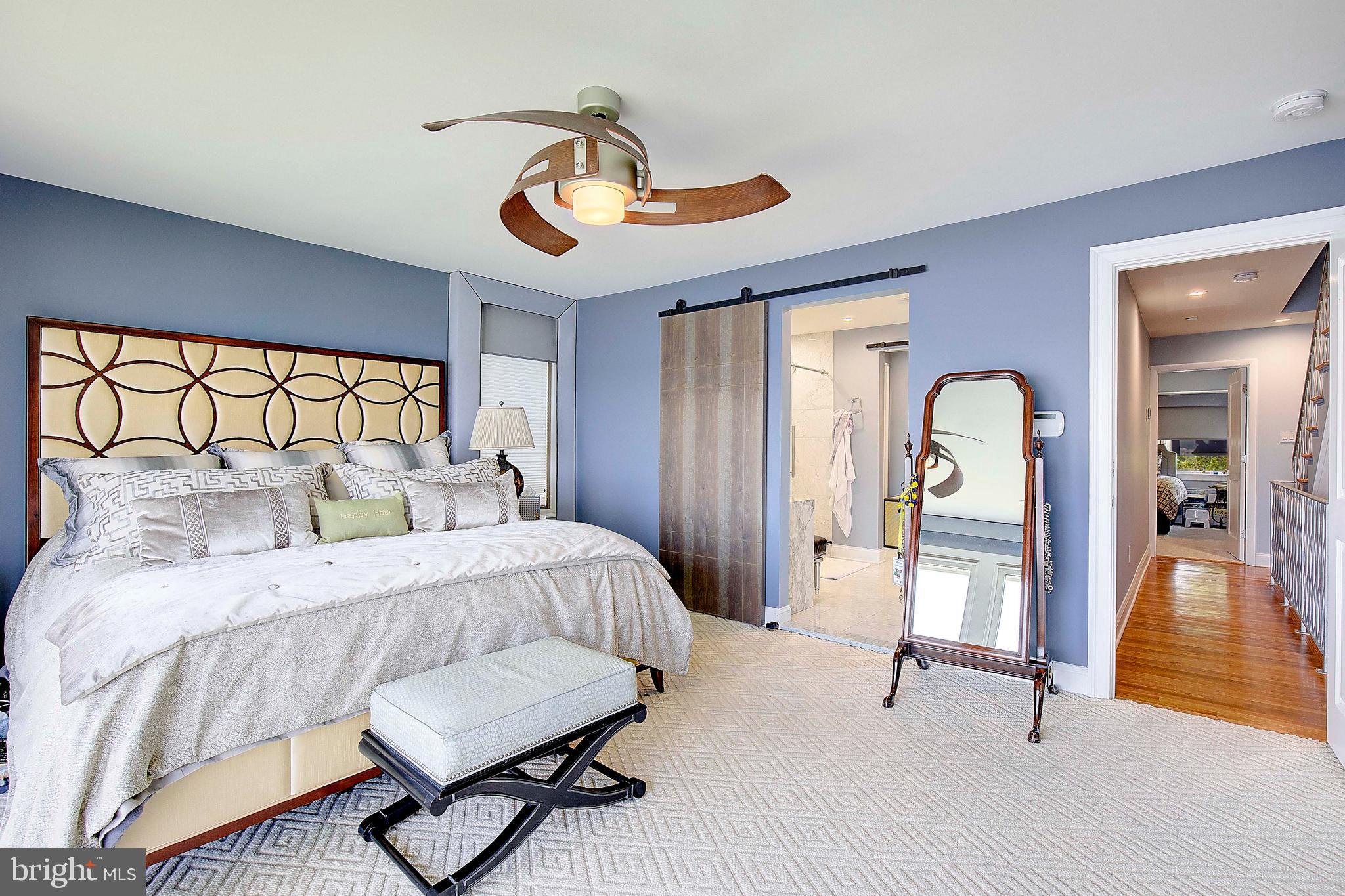 8 Eastern Avenue Annapolis, MD 21403 - Photo 30 of 55 a bedroom with a bed and a chandelier