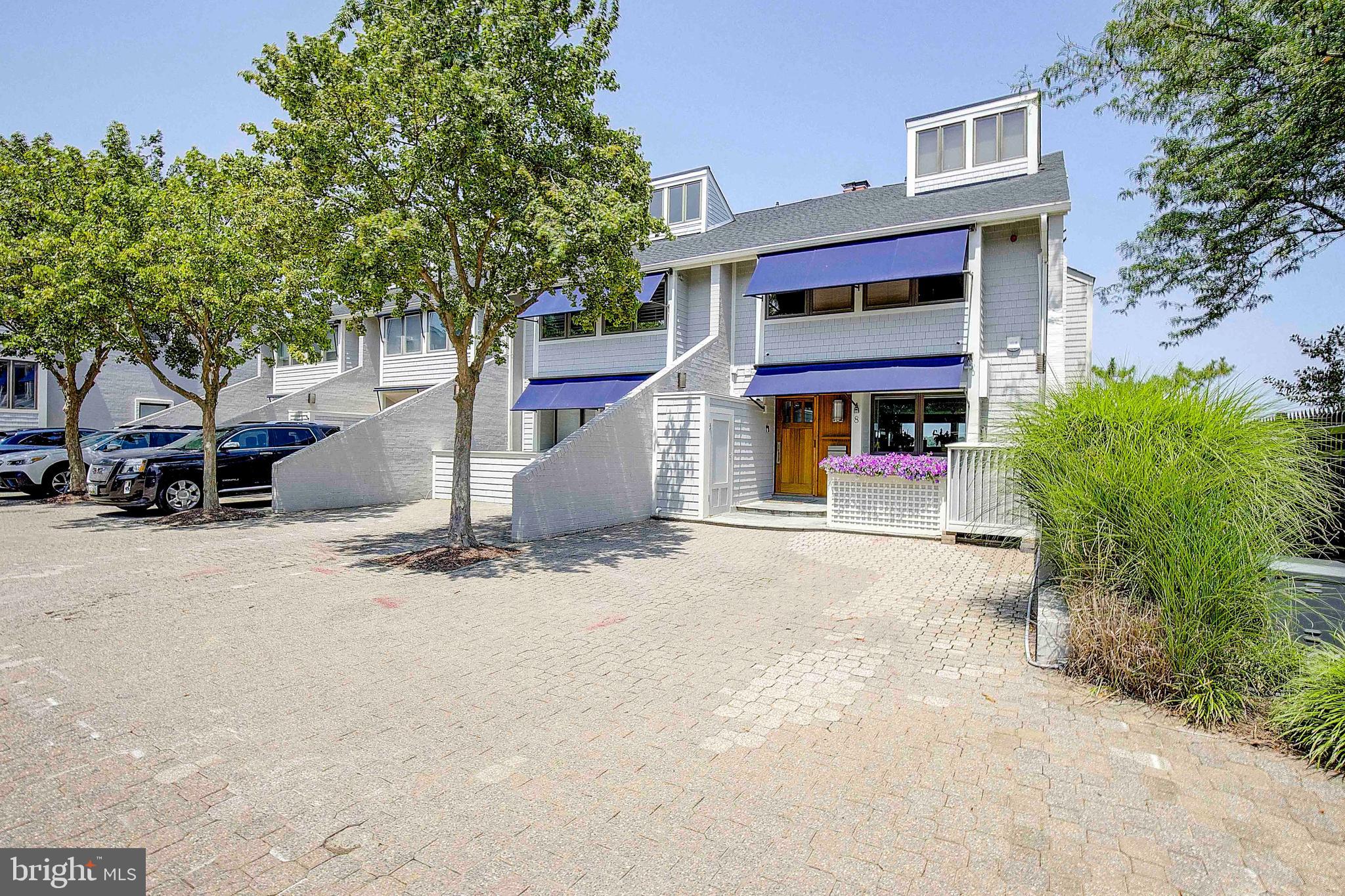 8 Eastern Avenue Annapolis, MD 21403 - Photo 3 of 55 a view of a building with large trees and a car parked in front of it