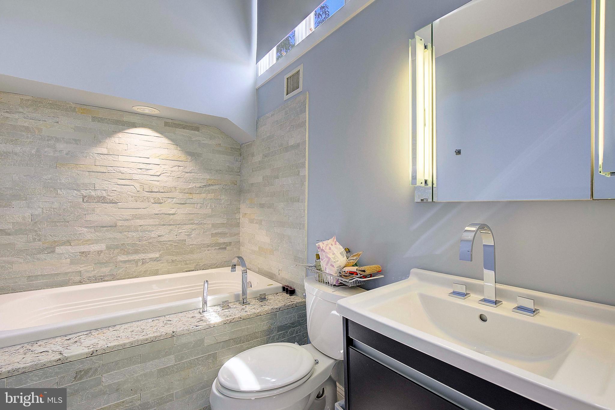 8 Eastern Avenue Annapolis, MD 21403 - Photo 36 of 55 a bathroom with a sink mirror toilet and bathtub