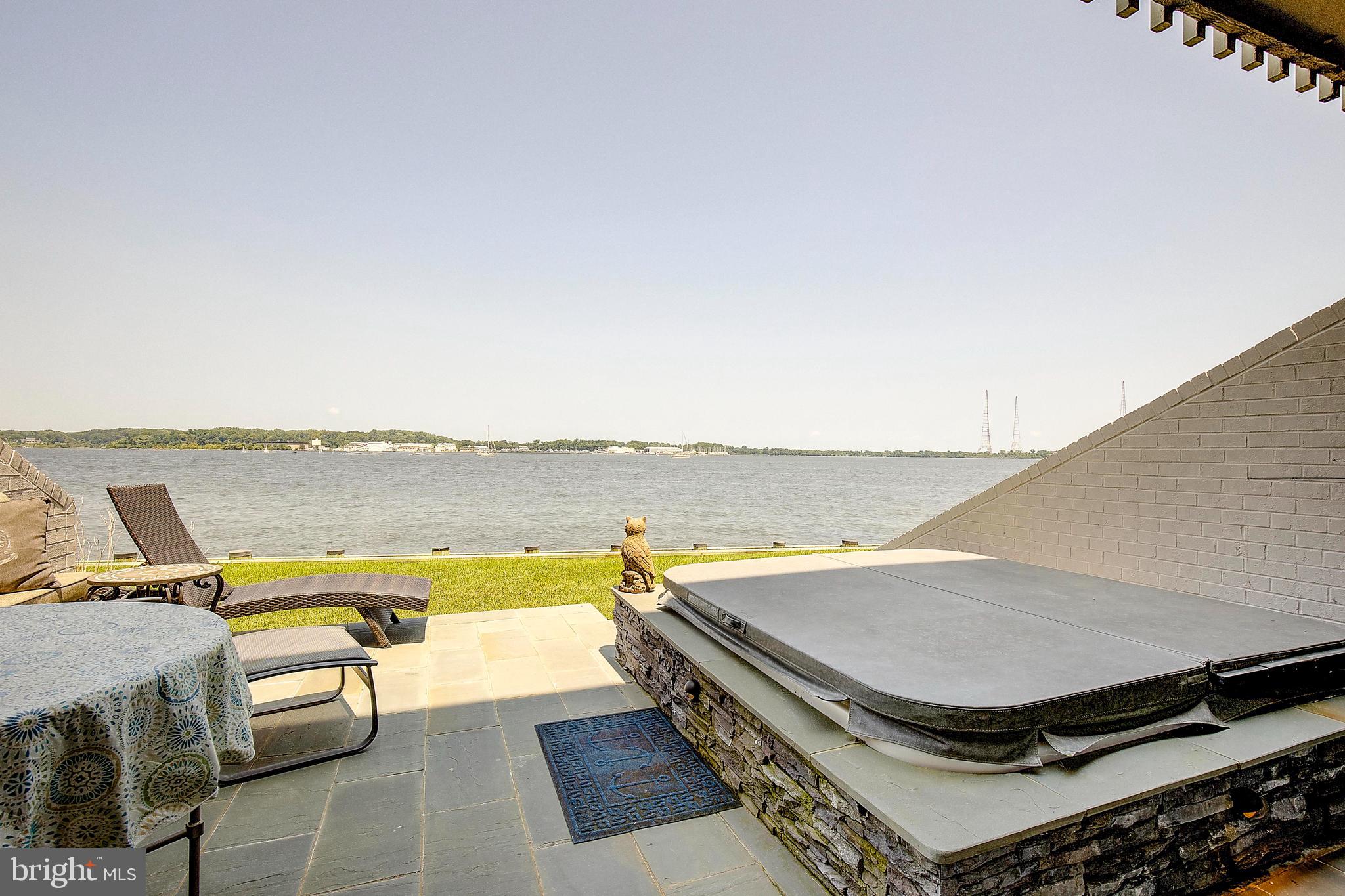 8 Eastern Avenue Annapolis, MD 21403 - Photo 40 of 55 a view of a patio with lawn chairs next to water