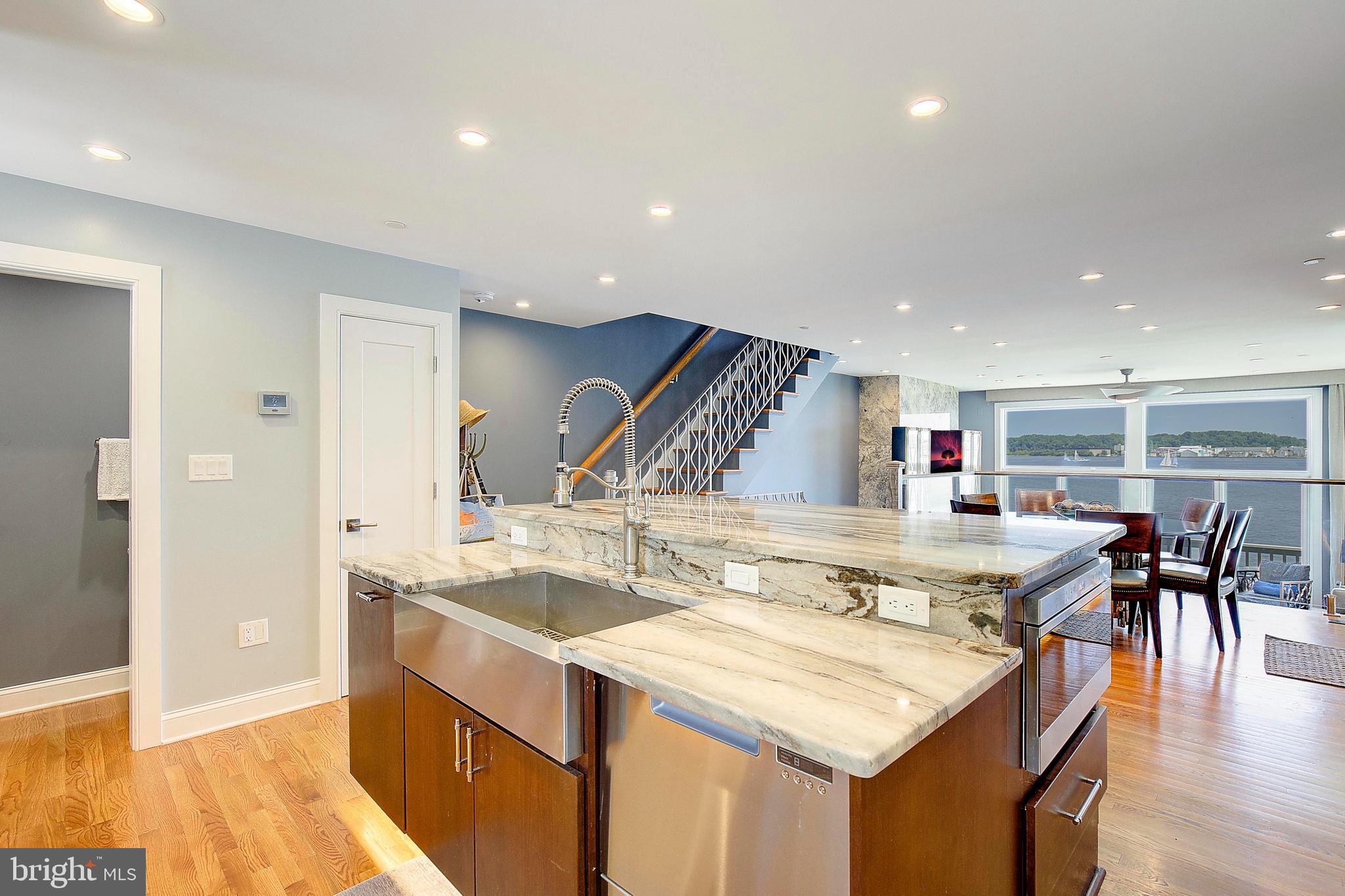 8 Eastern Avenue Annapolis, MD 21403 - Photo 7 of 55 a kitchen with a stove and chairs