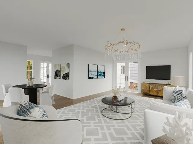 a living room with furniture a flat screen tv and a large window