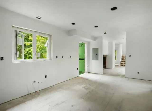 a view of an empty room with a window