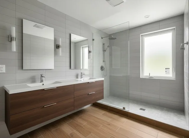 a bathroom with a double vanity sink and mirror with shower