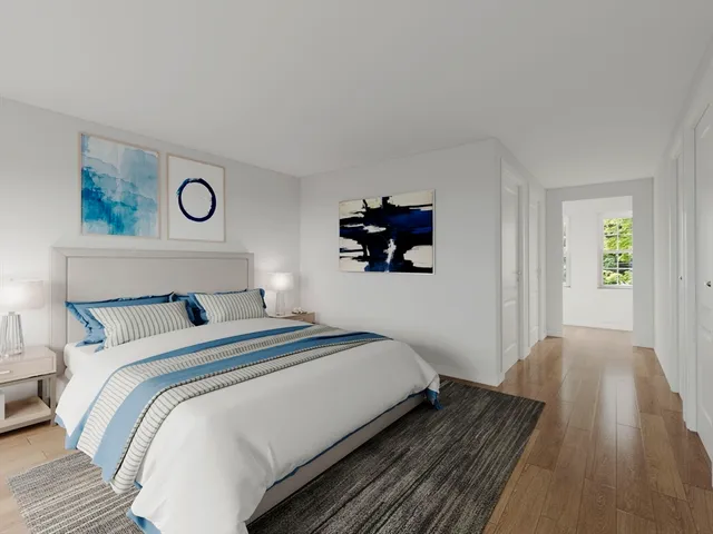 a bedroom with a bed and a table