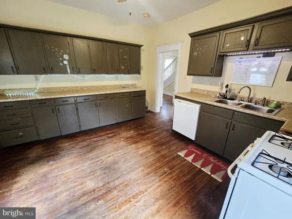 a kitchen with wooden cabinets and sink