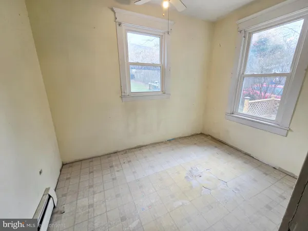 an empty room with windows