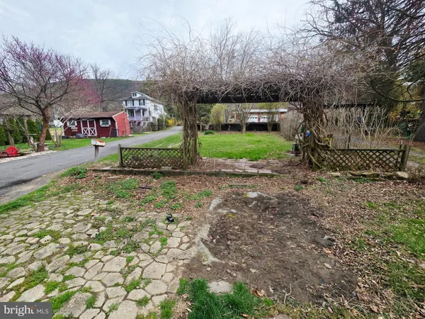 a view of a street with houses on both side