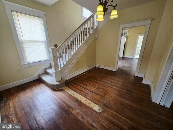 a view of an entryway with wooden floor
