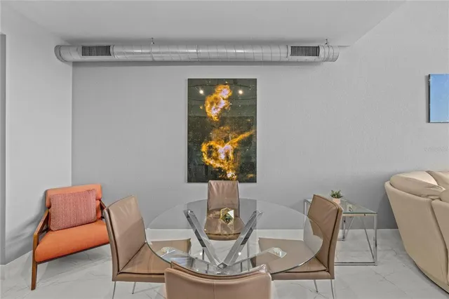 a living room with furniture fireplace and a window