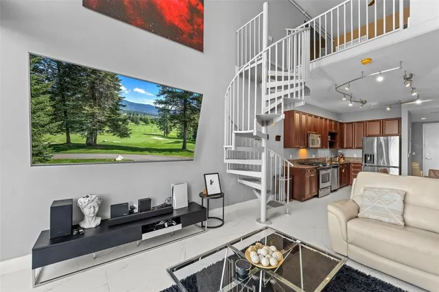 a view of living room with furniture and window