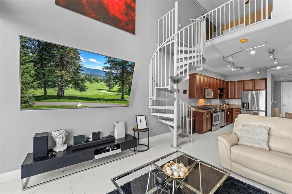 150 East Robinson Street, Unit 1007 Orlando, FL 32801 - Photo 17 of 31 a living room with furniture and a flat screen tv