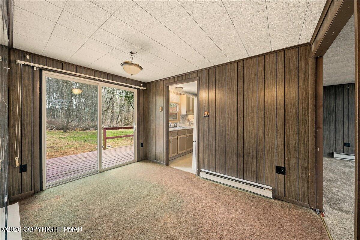 3416 Walnut Road Gilbert, PA 18331 - Photo 12 of 27 a view of an empty room with a sliding door