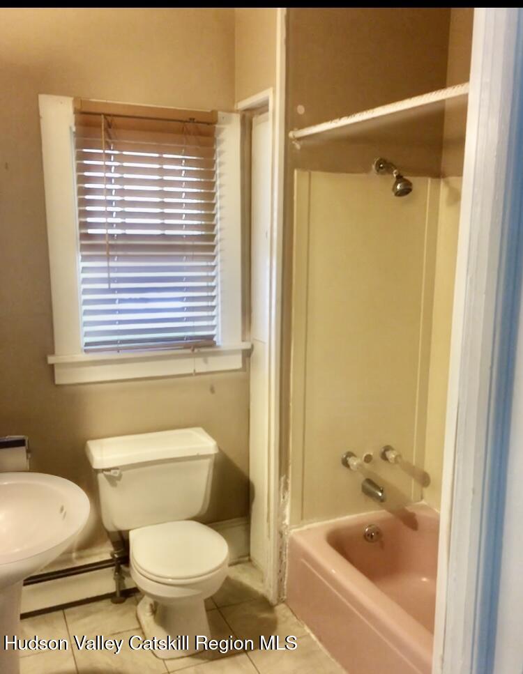 351-353 Old Rte 209 Hurley, NY 12443 - Photo 3 of 14 a bathroom with a toilet and a bathtub