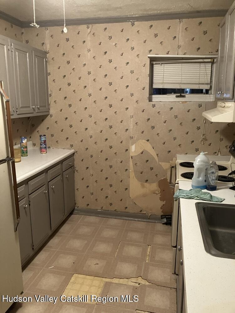 351-353 Old Rte 209 Hurley, NY 12443 - Photo 8 of 14 a bathroom with a sink a toilet and mirror