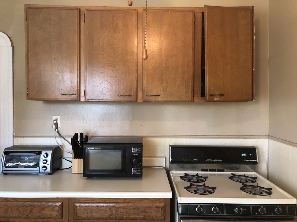 82 Garfield Street Springfield, MA 01108 - Photo 6 of 7 a stove top oven sitting inside of a kitchen