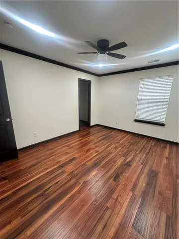 a view of front door with wooden floor