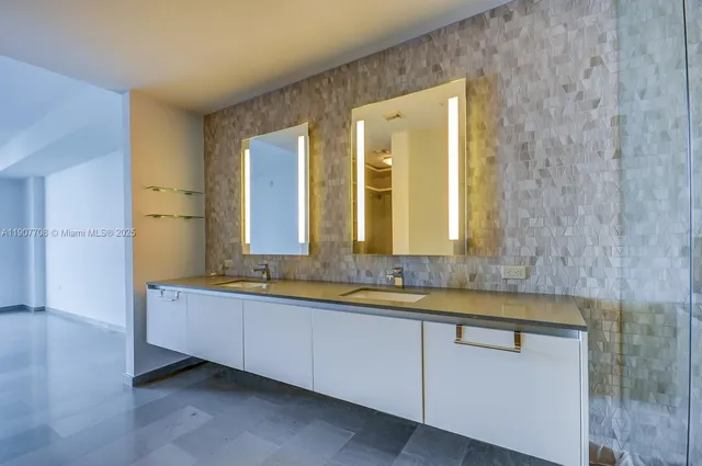 a view of an empty room with glass door