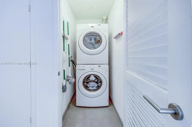 a kitchen with granite countertop a sink and cabinets