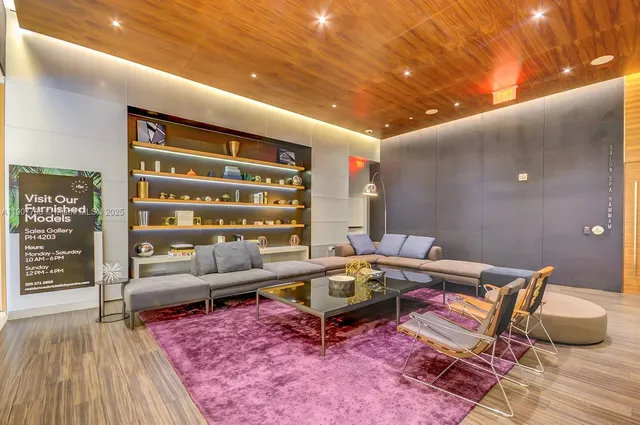 a living room with furniture and a rug