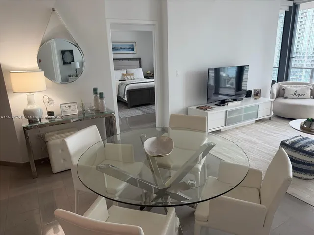 a bed room with bed and a night stand