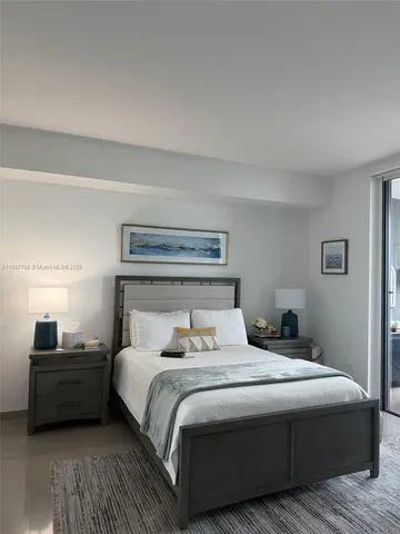 a bathroom with a granite countertop toilet sink and mirror