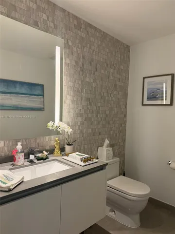 a kitchen with a table and chair