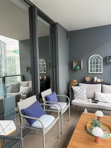 a living room with furniture a rug and a table