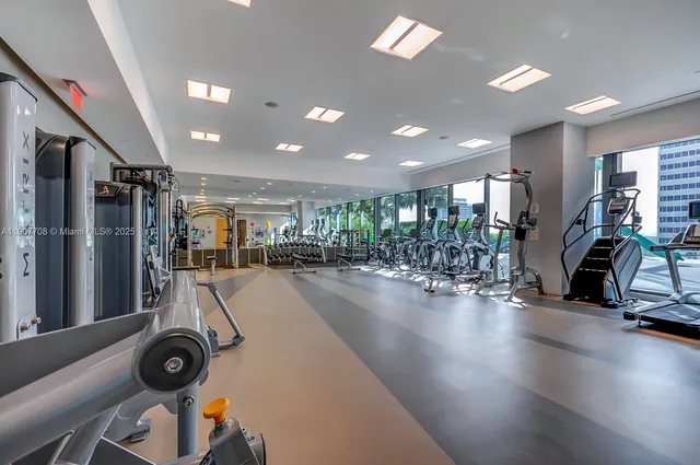 a lobby with furniture and floor to ceiling window