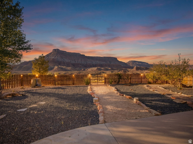 1440 West 100 South Virgin, UT 84779 - Photo 3 of 45 Expansive desert landscape with a prominent mountain range backdrop