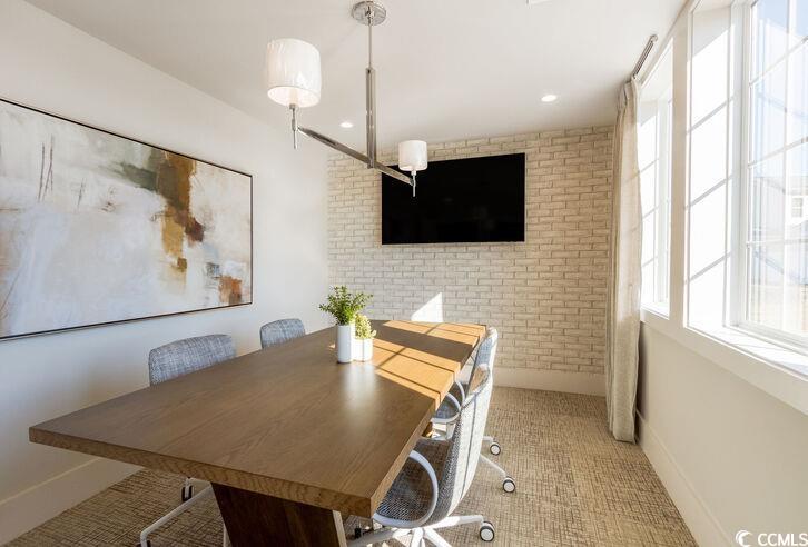 8840 Henry Road, Unit LANTANA Longs, SC 29568 - Photo 19 of 30 Dining space with recessed lighting, baseboards, and brick wall